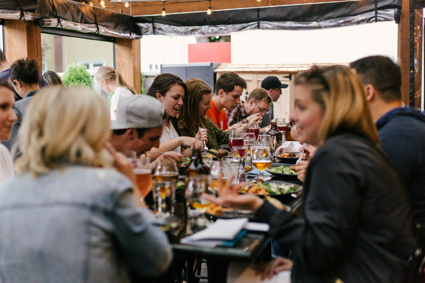 Friends sharing an evening around a rooftop table
